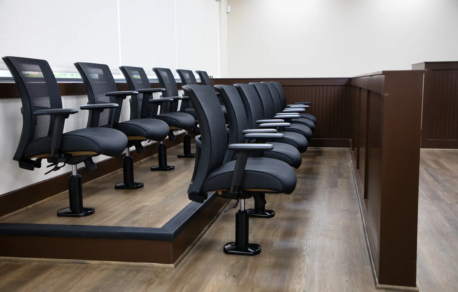 Mock Court Room jury box — rows of seating on a raised platform with a wood rail